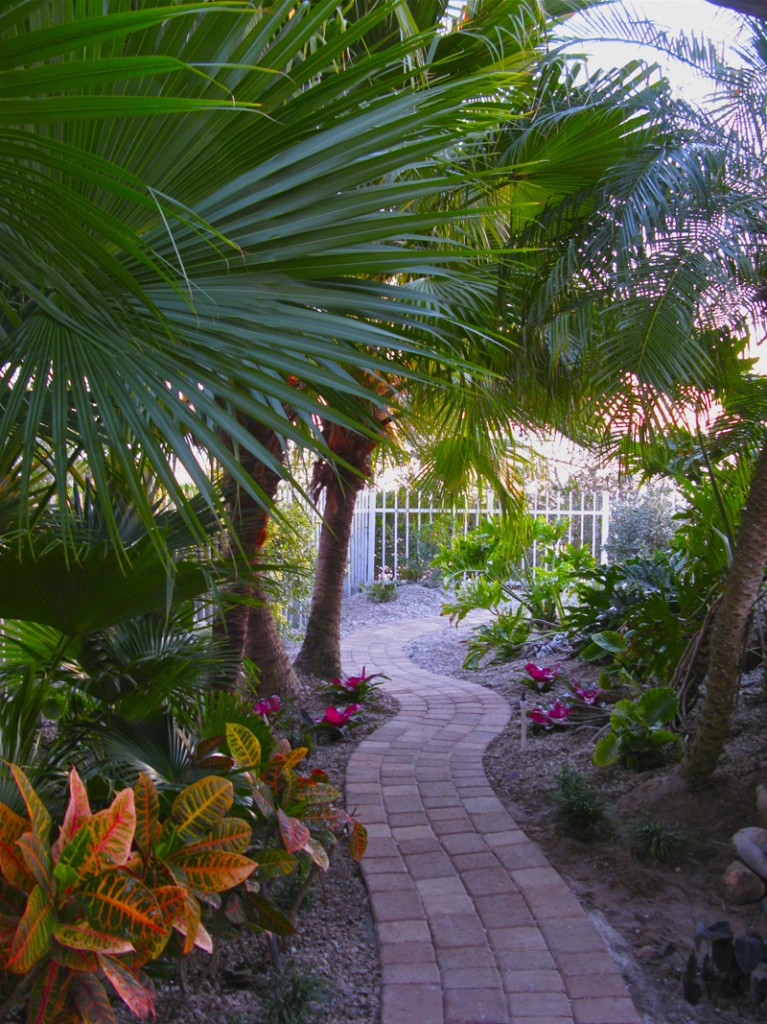 Transformed into a lovely grotto with paver pathway to the waterfront space.